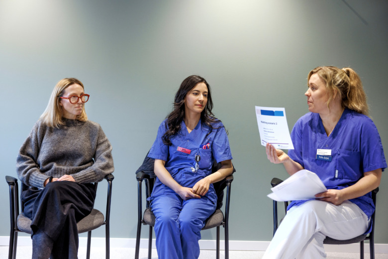 Ione Linney, MD, Surgeon and Newly Licensed Nurse Amal Abdel Dayem listen to Training Leader Stephanie Listervelt, who introduces the new simulation exercise.  Photo: Lisa Thaner